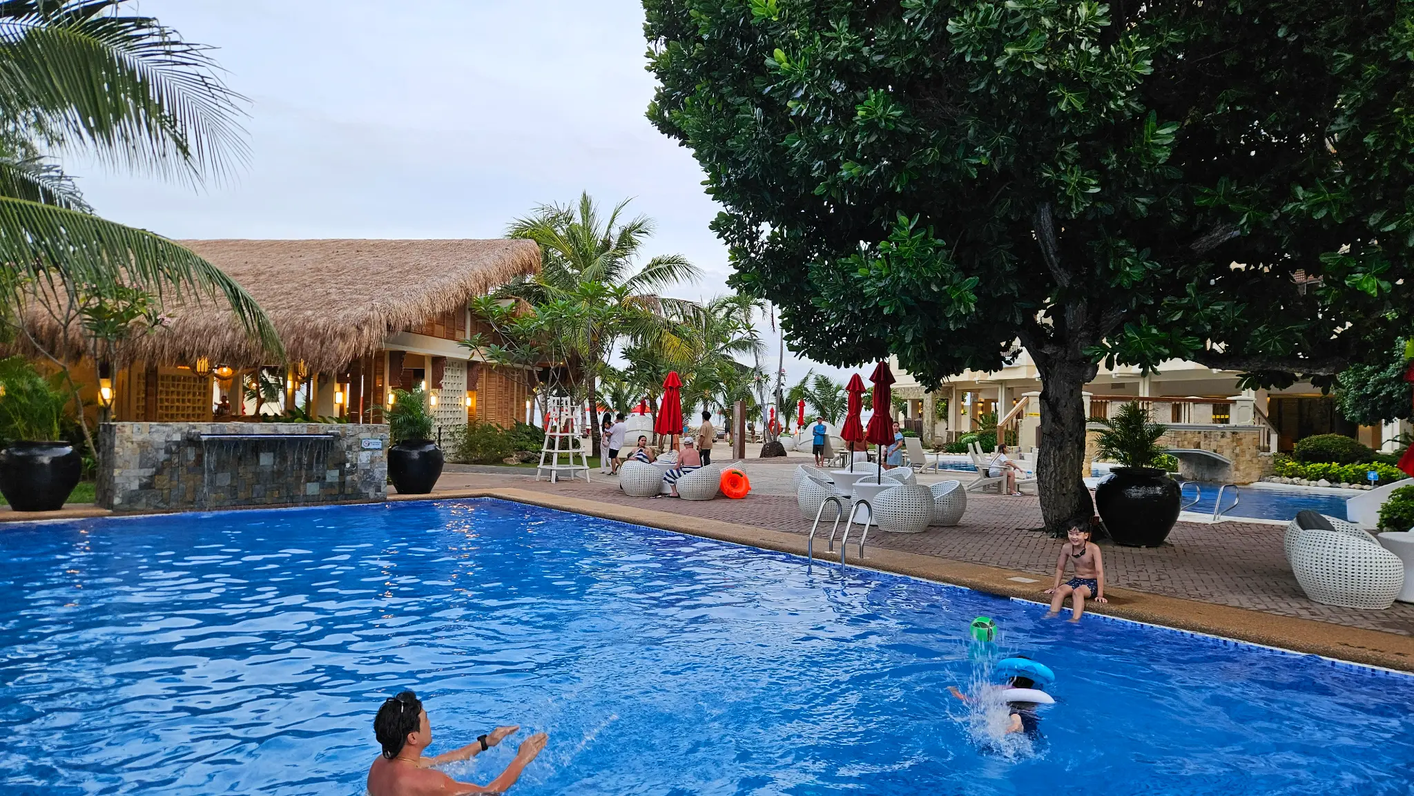 Kids playing in the pool at Costabella Tropical Beach Hotel, Mactan Island Cebu Philippines