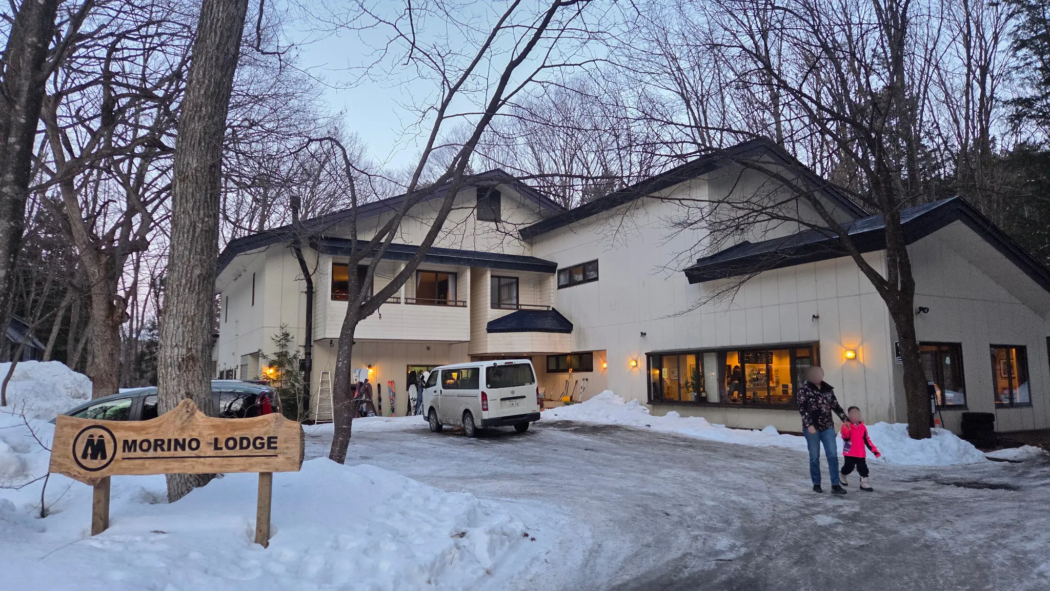 Morino Lodge entrance sign in the snow, Hakuba